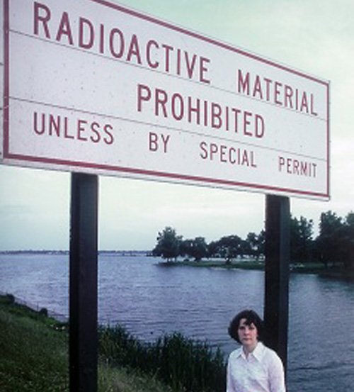 Beth next to Radioactive Sign