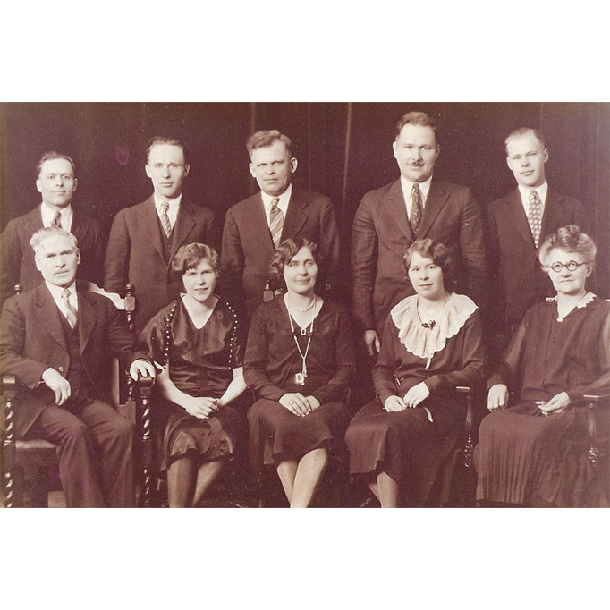 First row, from left, Michael Boos, Helen Pearson, Mary, Genevieve Tarp, Theresa. Back row: from left, Dad, twin brother Bernard, August Pearson, Gus, and Lawrence.