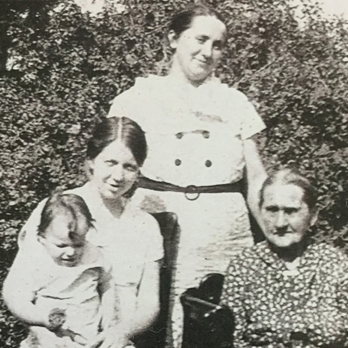 Four generations with Mom holding Theresa, Gram, and Great Grandmother Rose Bakula.